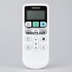 Hitachi remote control on a wooden surface with a blurred indoor background