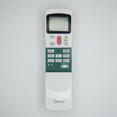 Midea remote control on a wooden surface with vegetables