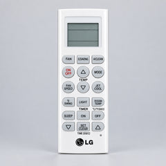 LG remote control with a blurred green background