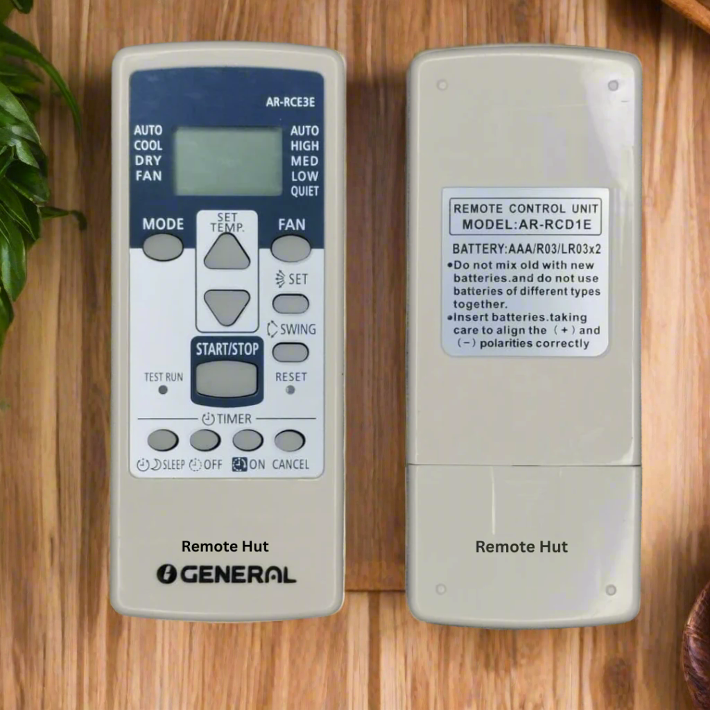 Two remote control units for air conditioning on a textured surface