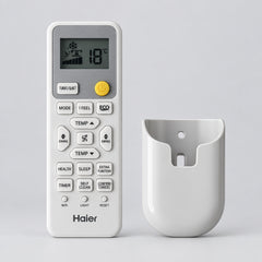 A Haier air conditioner remote control and its matching wall mount bracket, shown on a plain white background.