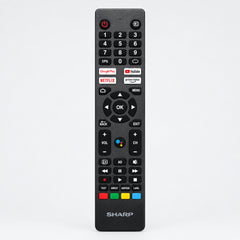 Black Sharp remote control on a white background