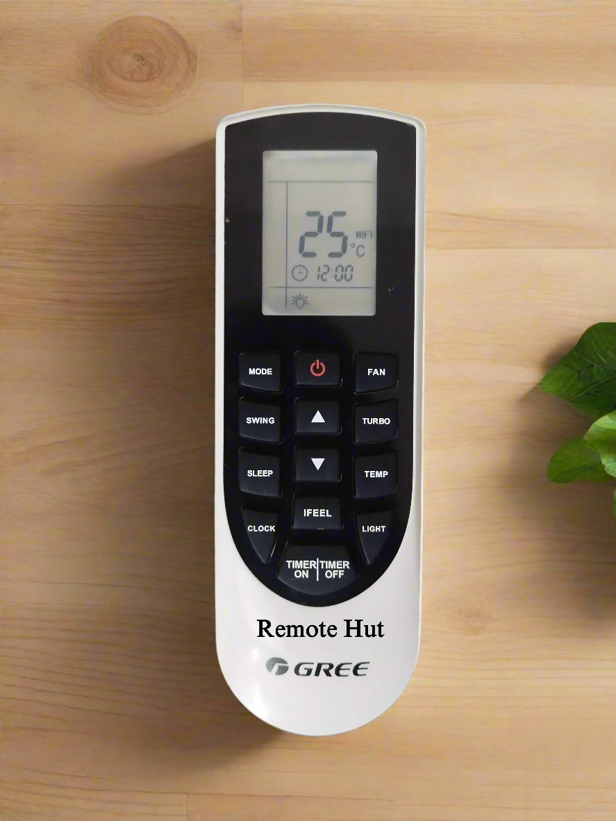 Gree remote control on a wooden surface