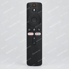 A black remote control with buttons, designed for voice commands and compatible with various electronic devices.