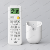 A white Haier remote control for air conditioner or refrigerator temperature adjustment, shown next to a matching white plastic wall mount holder against a plain light gray background.
