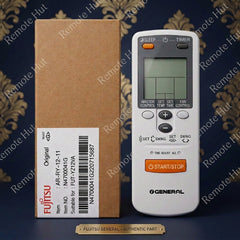 Fujitsu General air conditioner remote control next to its original brown cardboard packaging box with a white label, displayed on a dark patterned background.