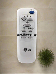 LG remote control on a beige tiled wall with 'REMOTE HUT' branding.