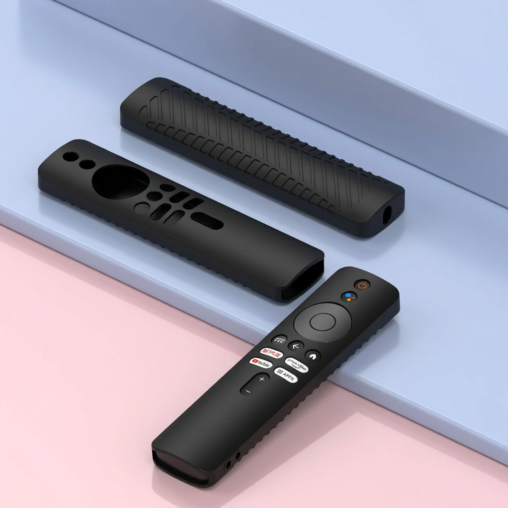 Three black protective silicone covers for a remote control, shown in different states of use (one fitted, two bare to show the textured grip and cutouts), arranged on a modern two-tone light blue and pink background.