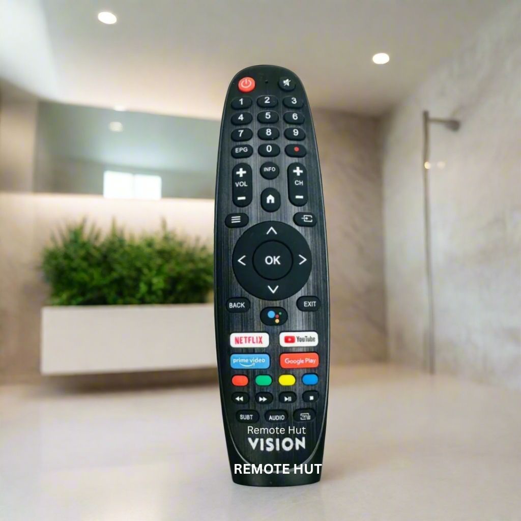 Black remote control with colorful buttons on a blurred indoor background